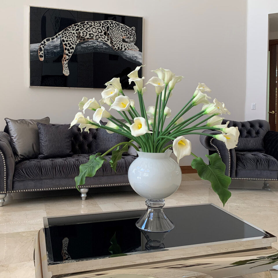 Refine vase with multiple white calla lilies